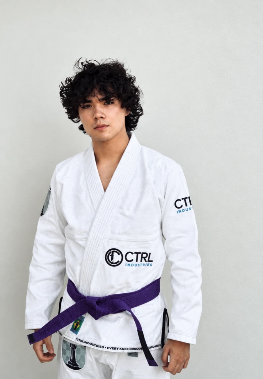 Sai Abril in a white gi with his purple belt